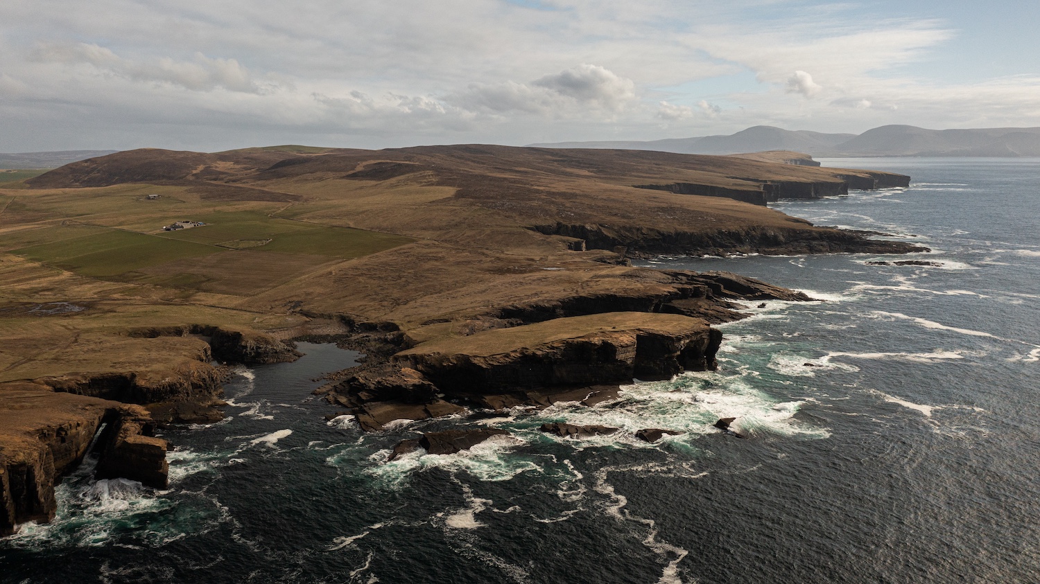 A dramatic image of the coastline of Orkney